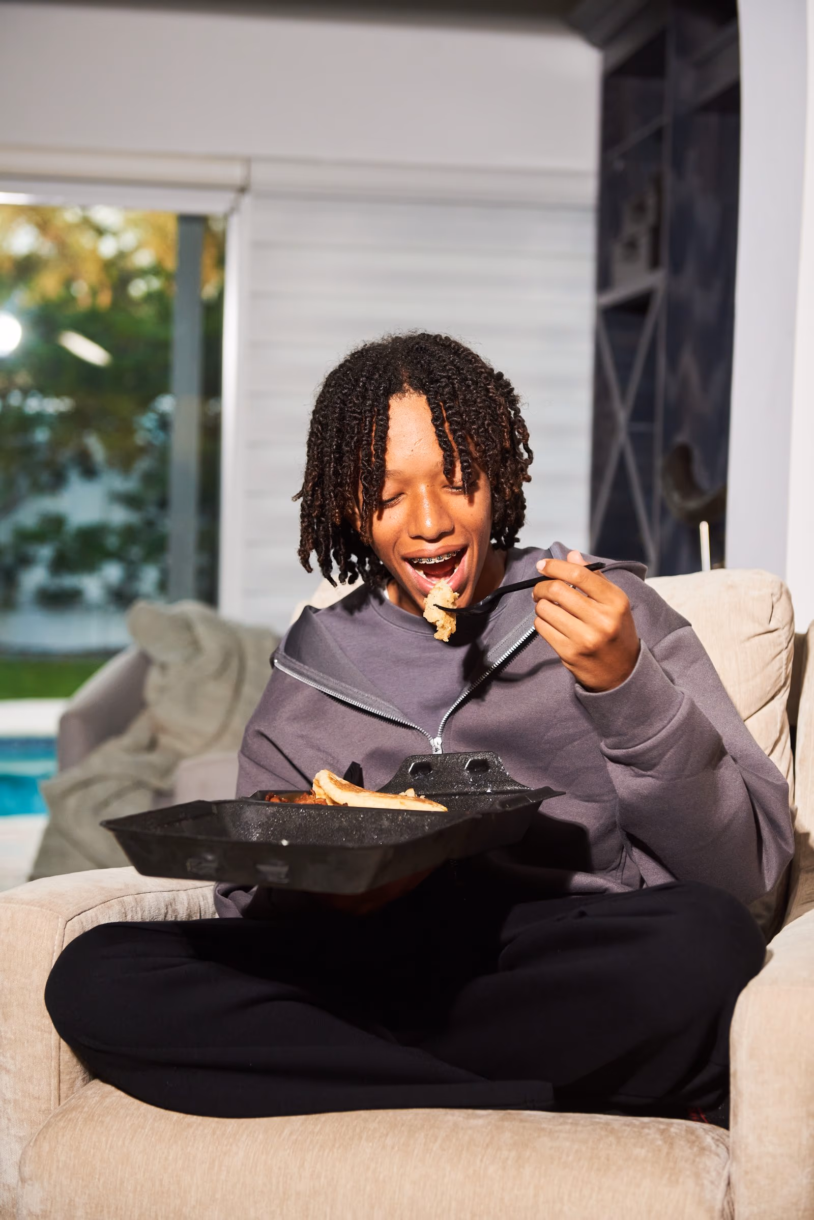 A customer enjoying a meal delivered by ETNOWE